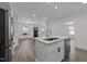 Bright and open kitchen with stainless steel appliances and center island with a sink at 819 Cumberland St, Raleigh, NC 27610