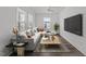 Bright living room with a modern sectional, and large windows at 819 Cumberland St, Raleigh, NC 27610