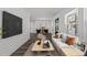 Open-concept living room with modern decor, connected to the dining area at 819 Cumberland St, Raleigh, NC 27610