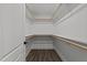 Spacious walk-in closet with wooden storage racks and hardwood floors at 819 Cumberland St, Raleigh, NC 27610