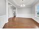 Bright dining room with hardwood floors and elegant chandelier at 85 Cardona Ct, Fuquay Varina, NC 27526