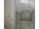 Finished attic room with neutral carpet, bright natural light and gray walls at 945 Sycamore St, Rocky Mount, NC 27801