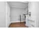 Unfinished basement with concrete walls, door to utility room, and water heater at 945 Sycamore St, Rocky Mount, NC 27801