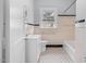 Classic bathroom with tiled floors, a tub, and a vanity with a sink at 945 Sycamore St, Rocky Mount, NC 27801