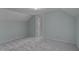Bedroom featuring gray walls, neutral carpet and natural light at 945 Sycamore St, Rocky Mount, NC 27801