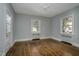 Spacious bedroom with hardwood floors and large windows at 945 Sycamore St, Rocky Mount, NC 27801