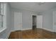 Well-lit bedroom featuring hardwood floors and ample space at 945 Sycamore St, Rocky Mount, NC 27801