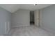 Bedroom featuring gray walls, neutral carpet, and a closet at 945 Sycamore St, Rocky Mount, NC 27801