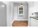 Inviting dining area with a charming window and built-in storage, complemented by modern lighting at 945 Sycamore St, Rocky Mount, NC 27801