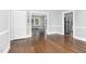 Elegant dining area showcasing hardwood floors, bright lighting, and seamless flow to other living spaces at 945 Sycamore St, Rocky Mount, NC 27801