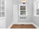 Bright dining area with a window, built-in storage, and a glass-paneled door for seamless transitions at 945 Sycamore St, Rocky Mount, NC 27801