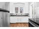 Traditional kitchen features bright natural light from windows over the sink at 945 Sycamore St, Rocky Mount, NC 27801