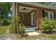Covered porch with ceiling fan and access to backyard at 945 Sycamore St, Rocky Mount, NC 27801