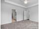 Main bedroom with ensuite bathroom access and ceiling fan at 91 Priming Way, Angier, NC 27501