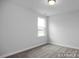 Bright bedroom with a window overlooking the water at 91 Priming Way, Angier, NC 27501