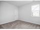 Bright bedroom with carpeted floors and large window at 91 Priming Way, Angier, NC 27501