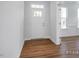 Bright entryway with hardwood floors and white door at 91 Priming Way, Angier, NC 27501