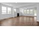 Spacious living room featuring hardwood floors and a fireplace at 91 Priming Way, Angier, NC 27501