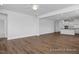 Open living room with hardwood floors and kitchen views at 91 Priming Way, Angier, NC 27501