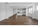 Spacious living room with hardwood floors and kitchen access at 91 Priming Way, Angier, NC 27501