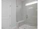 Walk-in shower with glass enclosure and built-in seat at 91 Priming Way, Angier, NC 27501