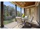 Relaxing back porch with comfortable seating and view of wooded backyard at 101 Bonica Creek Dr, Garner, NC 27529