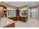 Spacious bathroom with granite countertops, plentiful vanity storage, and access to a large walk-in closet at 101 Bonica Creek Dr, Garner, NC 27529