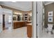Well-lit bathroom features expansive vanities, closet access, and a separate toilet room at 101 Bonica Creek Dr, Garner, NC 27529