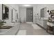 Bright bathroom with a modern vanity, glass shower, soaking tub, and neutral decor at 101 Bonica Creek Dr, Garner, NC 27529