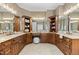Bathroom with dual sinks set in an elegant vanity, offering ample counter space and storage at 101 Bonica Creek Dr, Garner, NC 27529