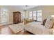 Serene bedroom featuring plantation shutters, hardwood floors, and natural light at 101 Bonica Creek Dr, Garner, NC 27529