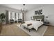 Serene bedroom featuring a large window, neutral tones, and stylish furnishings at 101 Bonica Creek Dr, Garner, NC 27529