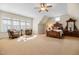 Spacious bedroom with seating area and unique wooden furniture creating a cozy atmosphere at 101 Bonica Creek Dr, Garner, NC 27529