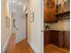 Butler's pantry featuring custom wood cabinetry, granite countertops, and a wine rack at 101 Bonica Creek Dr, Garner, NC 27529