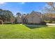 Beautiful brick home with a large lawn and manicured landscaping at 101 Bonica Creek Dr, Garner, NC 27529