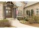 Inviting brick home featuring an arched entryway and decorative wood and iron front doors at 101 Bonica Creek Dr, Garner, NC 27529