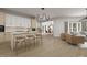 Open concept kitchen with modern island, counter seating, and views into living spaces at 101 Bonica Creek Dr, Garner, NC 27529