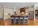 Beautiful kitchen with custom cabinetry, stainless steel appliances and island with bar stool seating at 101 Bonica Creek Dr, Garner, NC 27529