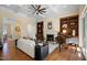 Spacious living room with fireplace, grand piano, hardwood floors and coffered ceilings at 101 Bonica Creek Dr, Garner, NC 27529