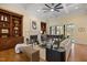 Elegant living room with fireplace, built-in bookshelves, grand piano and coffered ceiling at 101 Bonica Creek Dr, Garner, NC 27529