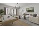 Open living room with a pool table, cozy seating, and natural light from large windows at 101 Bonica Creek Dr, Garner, NC 27529