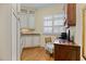 Bright home office featuring custom cabinets, natural light, and hardwood flooring at 101 Bonica Creek Dr, Garner, NC 27529
