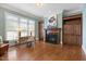 Elegant office space with custom built-ins, fireplace, and large windows providing ample natural light at 101 Bonica Creek Dr, Garner, NC 27529