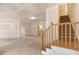 Large unfinished space featuring drywall, a staircase, and a concrete floor at 101 Bonica Creek Dr, Garner, NC 27529