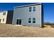 Gray vinyl-sided home with a sliding glass door at 110 Gabriel Ct, Clayton, NC 27520