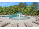 Community pool with a spraying fountain and lounge chairs at 110 Gabriel Ct, Clayton, NC 27520