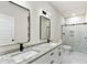 Modern bathroom with double vanity and walk-in shower at 110 Mohave Dr, Louisburg, NC 27549