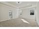 Bright bedroom with carpeted floors and ensuite bathroom access at 110 Mohave Dr, Louisburg, NC 27549
