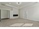 Spacious bedroom with fireplace and carpet flooring at 110 Mohave Dr, Louisburg, NC 27549