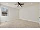 Spacious bedroom with ceiling fan and carpeted floor at 110 Mohave Dr, Louisburg, NC 27549